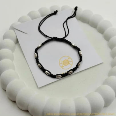 At Kanhaji Jewels (KJJ), we believe your baby deserves the purest protection. This unique Nazariya set features vibrant blue evil eye charms paired with delicate 2.5mm imported silver balls, creating a beautiful contrast against the traditional black beads. Crafted from certified 92.5 Sterling Silver, these bracelets are more than just jewelry—they are a symbol of love and safety. The blue evil eye is globally recognized for its power to ward off bad luck and negativity, while the silver beads add a premium, lasting shine that is gentle on your little one's skin. Key Highlights: Certified 92.5 Sterling Purity: Every silver bead is made of guaranteed high-purity silver, ensuring a hypoallergenic and durable finish. 2.5mm Imported Silver Balls: Features precision-crafted silver beads that offer a subtle yet sophisticated sparkle. Enhanced Evil Eye Protection: Adorned with multiple blue evil eye charms to provide maximum spiritual shielding for your baby. Soft & Adjustable Fit: Hand-strung on a comfortable black thread with a traditional red and black tassel finish for an easy, adjustable fit. The Perfect Blessing: An ideal gift for birth celebrations, naming ceremonies, or as a protective daily accessory for infants and toddlers. Product Specifications: Brand: Kanhaji Jewels (KJJ) Material: 92.5 Sterling Silver & Premium Protective Charms Silver Ball Size: 2.5mm (Imported) Design: Blue Evil Eye & Silver Bead Fusion Quantity: 1 Pair (Set of 2)